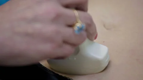 Doctor is using ultrasound machine to scan Stock Footage 63572859