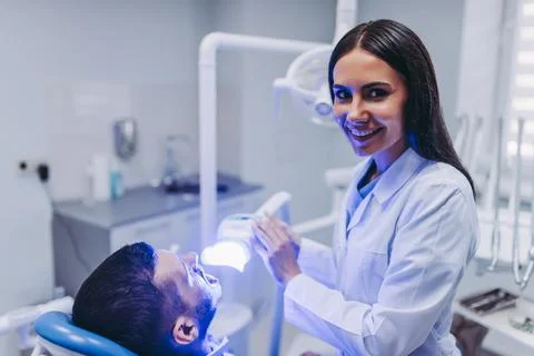 Doctor using uv lamp Stock Photos