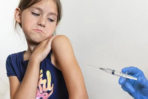Doctor vaccinating baby isolated on a white background. Children's fear of Stock Photos