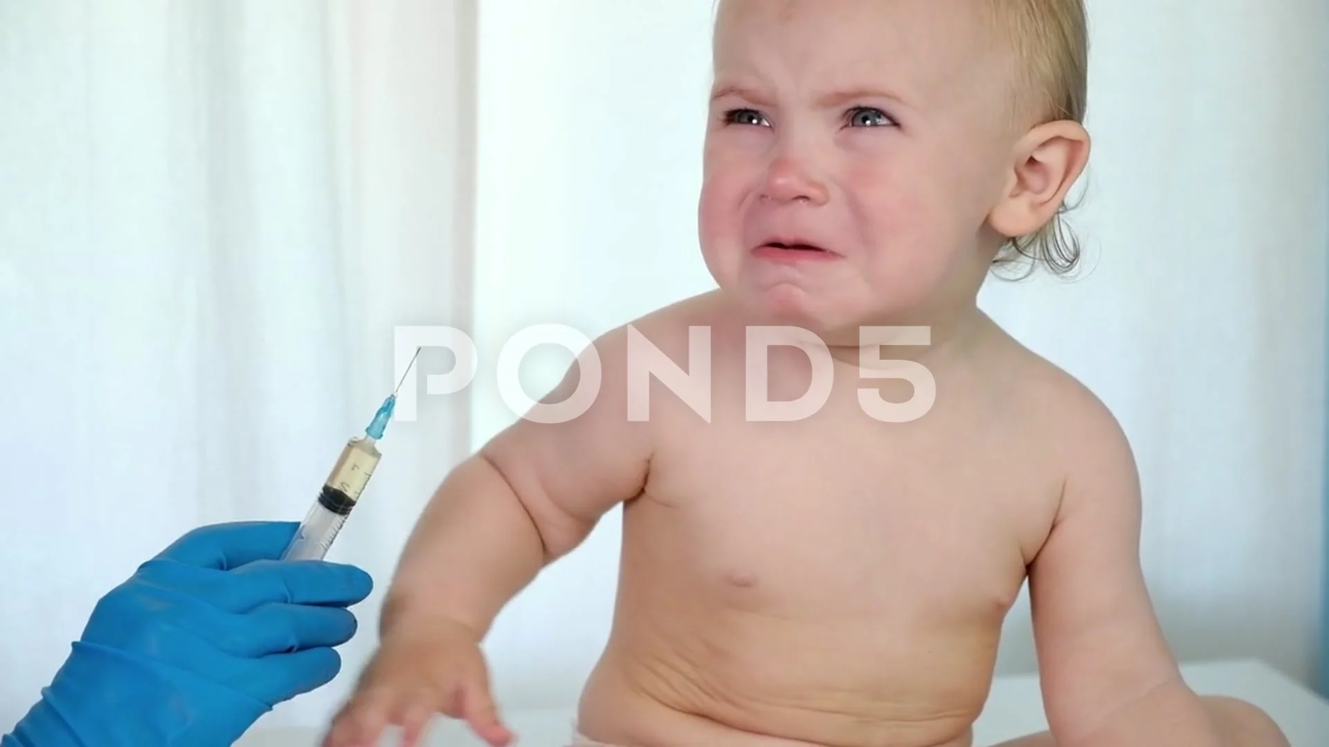 Doctor vaccinating crying baby in Stock Video Pond5