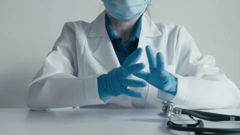 A doctor in a white coat with a professional stethoscope as an image health Stock Footage 252132385