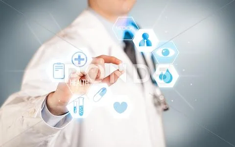 A doctor in white holding a pill Stock Photos