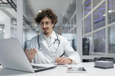 Doctor in White Lab Coat Using Laptop Computer Stock Photos