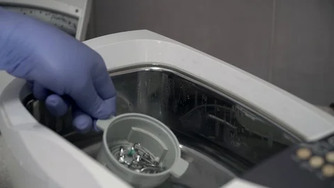The doctor will put dental instruments for cleaning by ultrasound. Sterilization Stock Footage 104509172