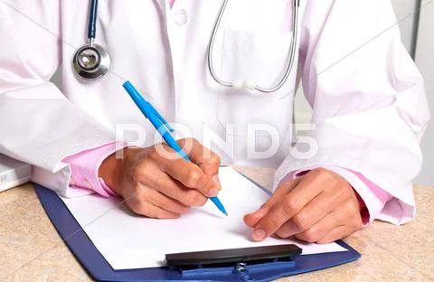 Doctor woman working in clinic. Stock Photos