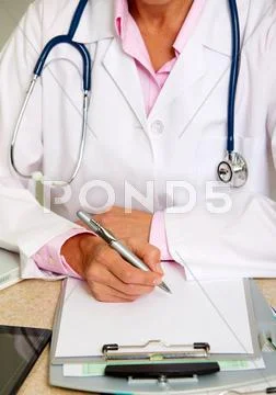 Doctor woman working in clinic. Stock Photos