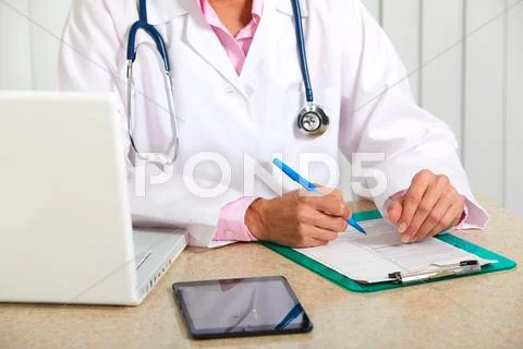 Doctor woman working in clinic. Stock Photos