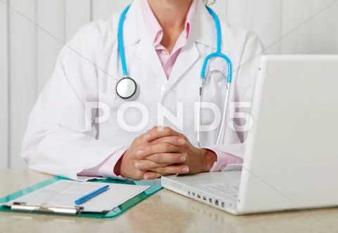 Doctor woman working in clinic. Stock Photos