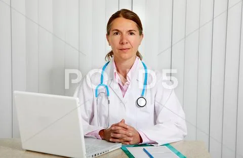 Doctor woman working in clinic. Stock Photos