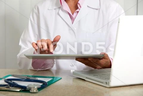Doctor woman working in clinic. Stock Photos