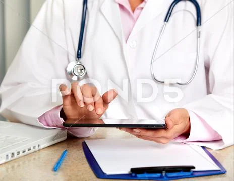 Doctor woman working in clinic. Stock Photos