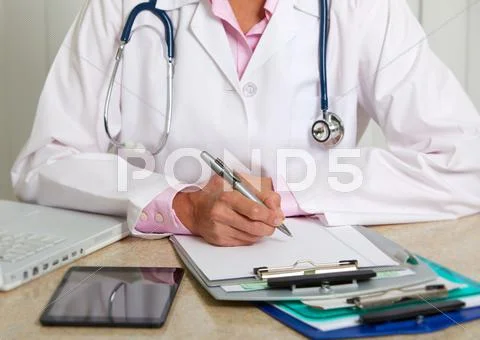 Doctor woman working in clinic. Stock Photos