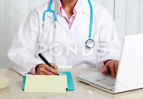 Doctor woman working in clinic. Stock Photos