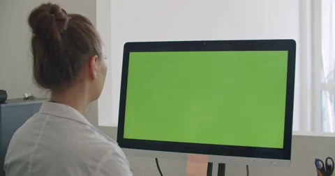 Doctor work on computer with green mock-up screen Stock Footage 133879917