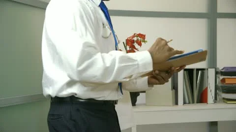 Doctor work interrupted by phone calls Stock Footage