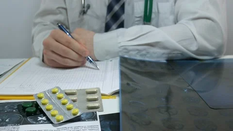 Doctor at work with the journal and data Video stock 87802024