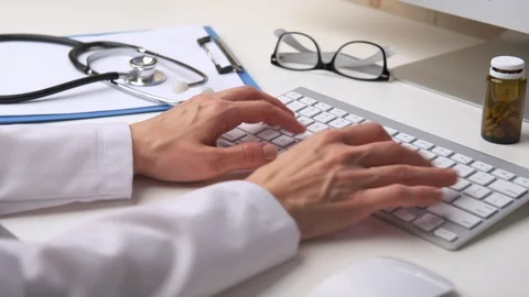 Doctor working at computer Video stock 93332648