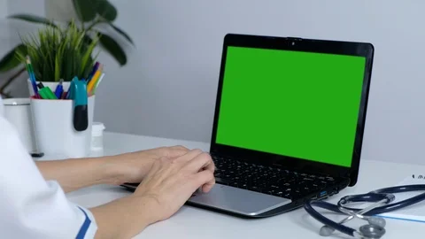 Doctor working on a computer, green screen for your website Stock Footage 120553267