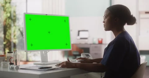 Doctor Working on Computer with Green Sc... | Stock Video | Pond5