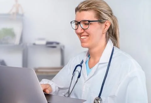 Doctor working on computer in the office Stock Photos