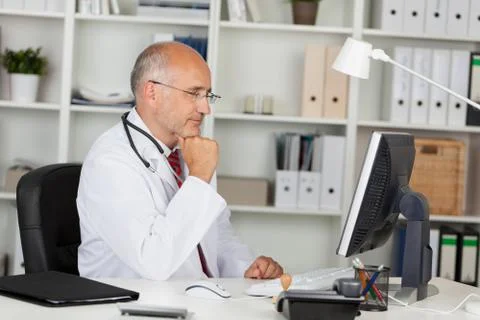 Doctor working with computer Stock Photos