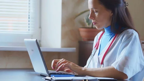 Doctor working on a digital tablet with copy space Stock Footage 94987312