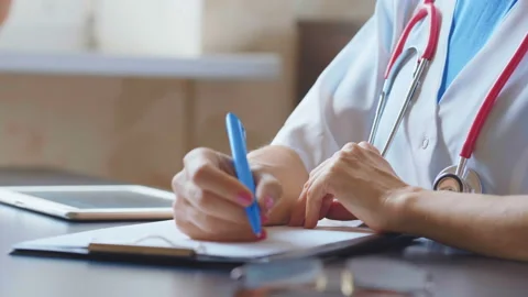Doctor working on a digital tablet with copy space Stock Footage 94988587