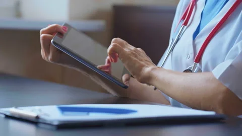 Doctor working on a digital tablet with copy space Stock Footage 94988640