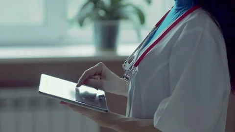Doctor working on a digital tablet with copy space Stock Footage 94988655