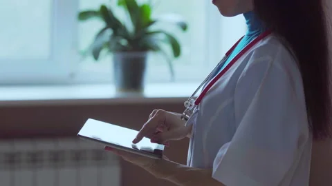 Doctor working on a digital tablet with copy space Video stock 94989134