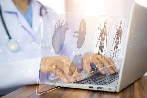 Doctor working with laptop computer  and Doctor using computer checking dat.. Stock Photos
