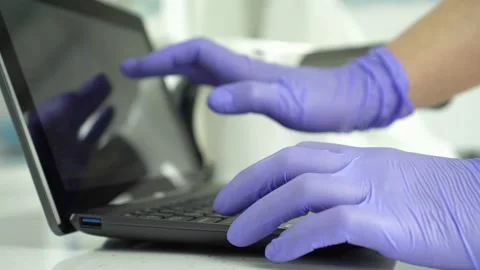 The doctor is working in a laptop Stock Footage 137032076