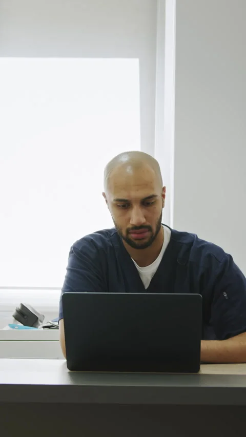 Doctor Working on a Laptop Stock Footage 316199031