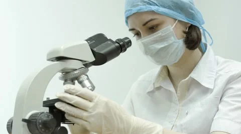 A Doctor Working With a Microscope Stock Footage 67463495