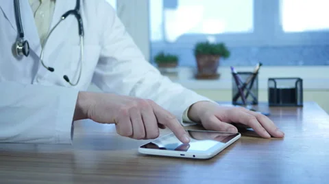 Doctor Working on a smart tablet  Stock-Footage 64063018