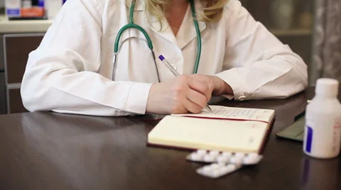 Doctor working with tablet computer and documents Video stock 59684895