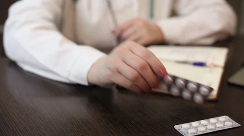 Doctor working with tablet computer and documents Video stock 59684949