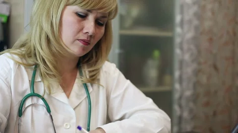 Doctor working with tablet computer and documents Video stock 59685009