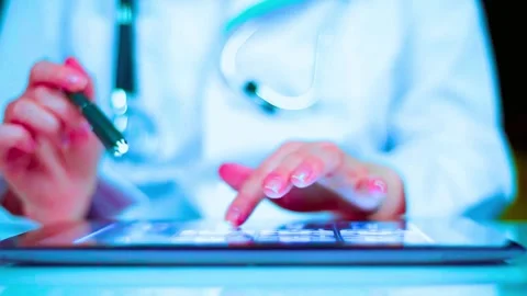Doctor working with tablet computer and pen close-up video in blue light Stock-Footage 341969871