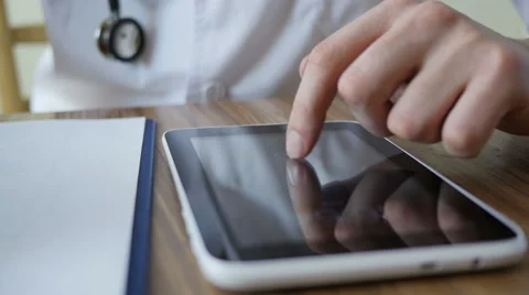 Doctor Working On Tablet Stock Footage 64062309