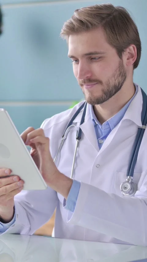 Doctor Working on Tablet in Office, Vertical Video Stock Footage 339580321