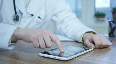 Doctor Working On Tablet Pc Stock Footage 64063031