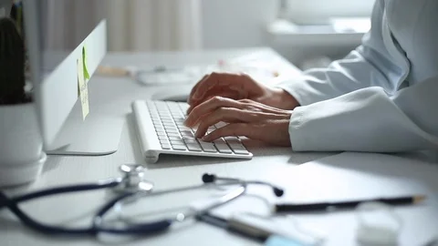 Doctor works on a computer keyboard. Close-up. Stock Footage 117518530