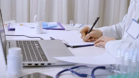 The doctor works at the desktop on the computer. Video stock 124600962