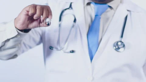 Doctor Writes Migraines on the transparent surface Stock Footage 248550418