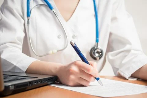Doctor writes Stock Photos