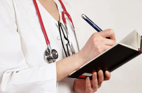 Doctor writes Stock Photos