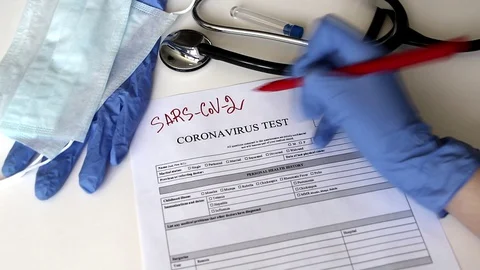 The doctor writes SARS-SoV-2. Stock Footage 129742665