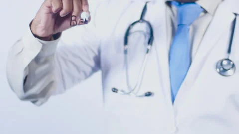 A doctor writes on the screen words Belly fat Stock Footage 248559376