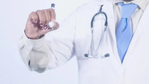 A doctor writes on the screen words Colonic Stock Footage 248585317